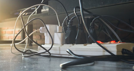 Electriical cords plugged into power strip
