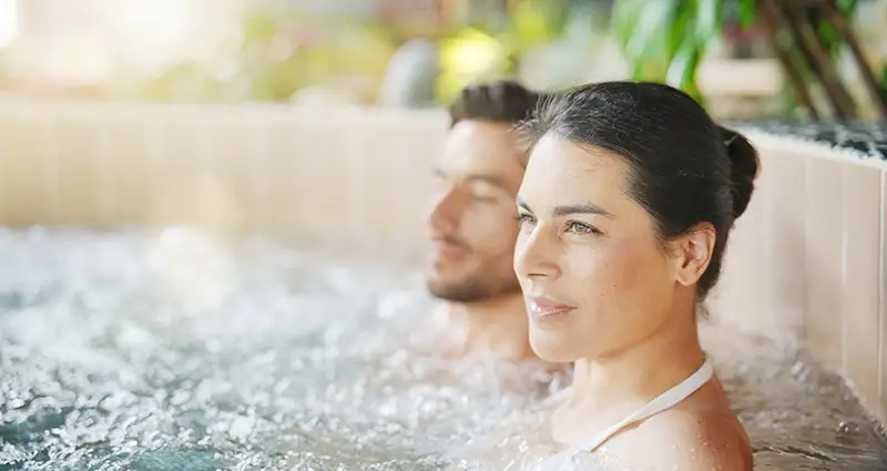 Couple enjoying their hot tub