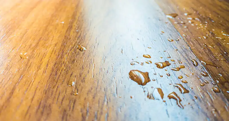 Water spill on wood floor from air conditioner in the house