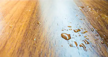 Water spill on wood floor from air conditioner in the house