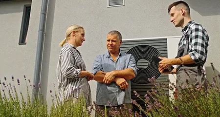 Technician talking to homeowners