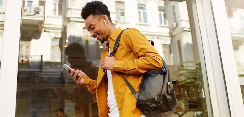 Woman on couch with pet and laptop