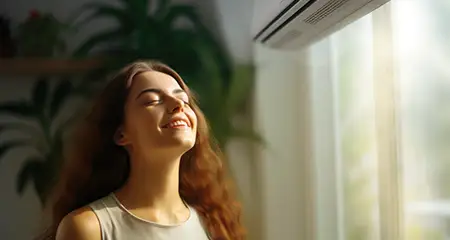 Young woman enjoying the AC
