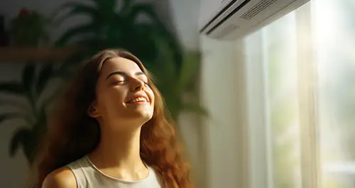 Young woman enjoying the AC