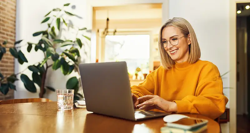 Happy woman at laptop
