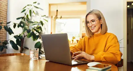Happy woman at laptop