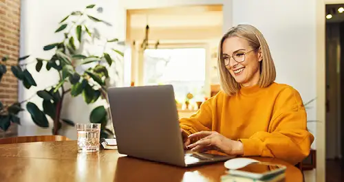 Happy woman at laptop