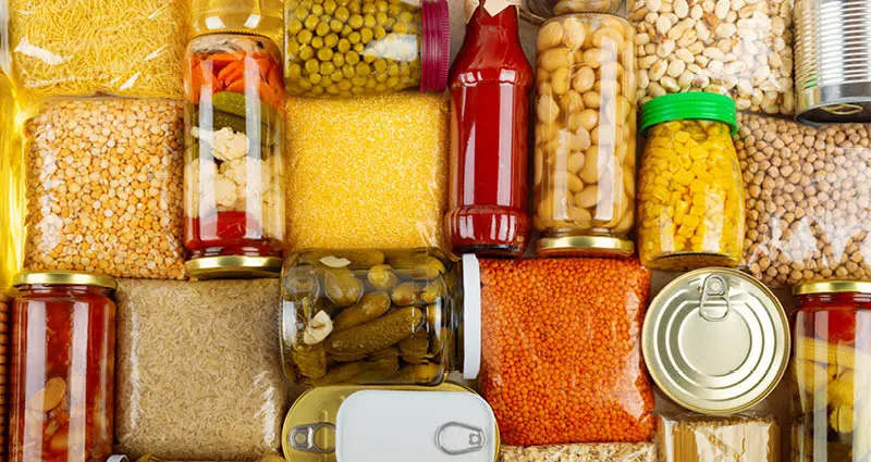 Non-perishable food laid on kitchen table