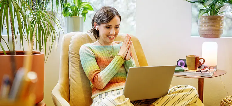 Lady on laptop seated in living room