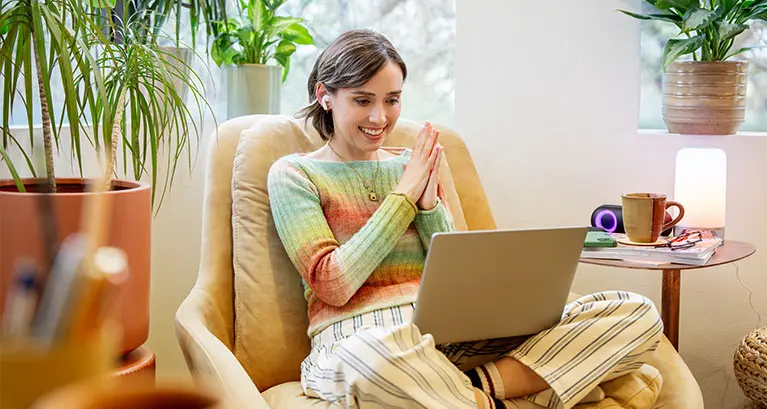Lady on laptop seated in living room