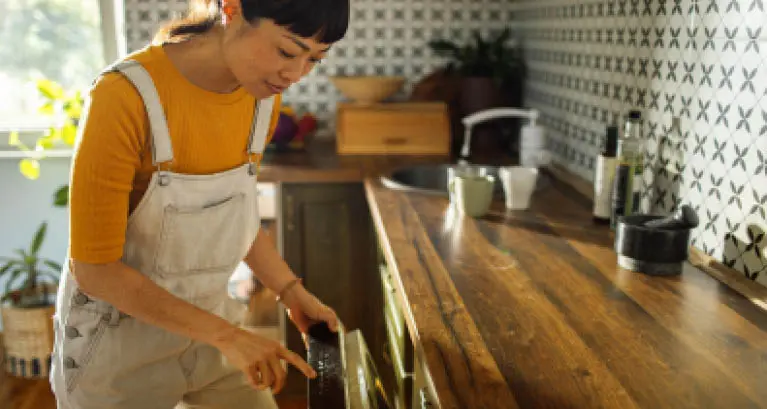 Loading the dishwasher before work