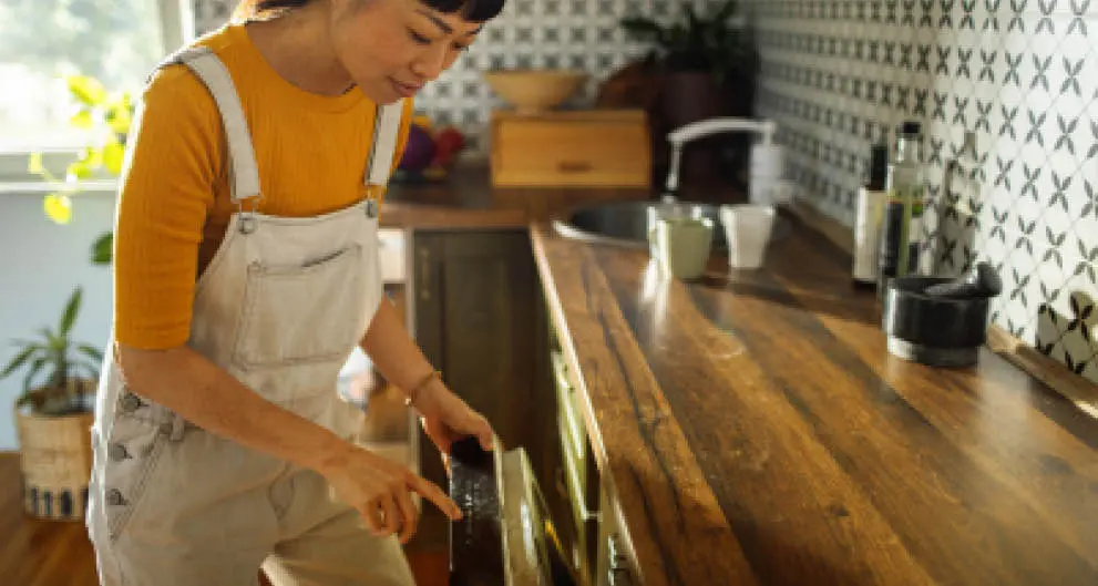 Loading the dishwasher before work