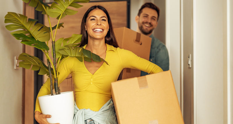 young couple moving into new home needing transfer energy
