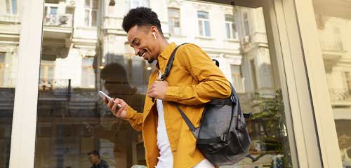 Woman on couch with pet and laptop