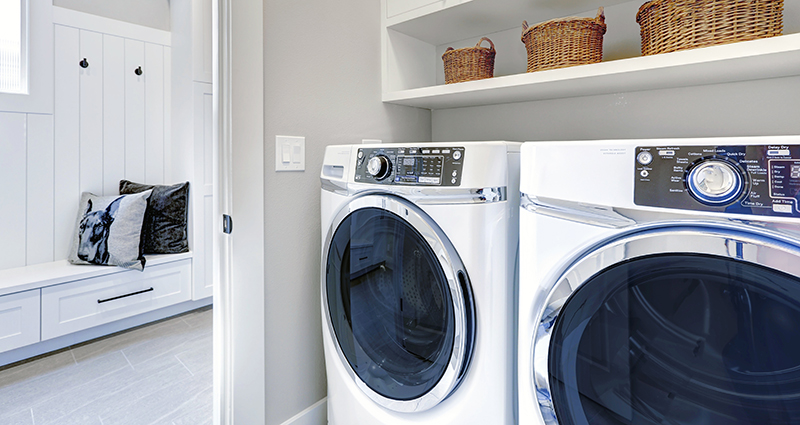 Photograph of a modern washer and dryer in a laundry room