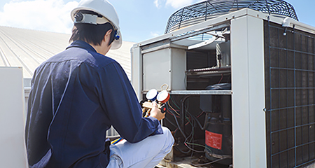 Photo of someone making repairs to their HVAC system