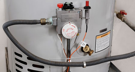 Close up of water heater controls