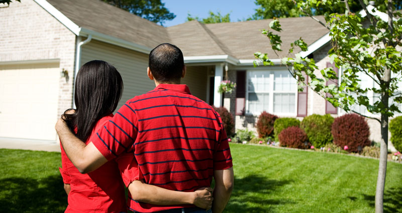 New homeowners admiring new home