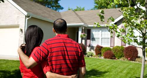 New homeowners admiring new home