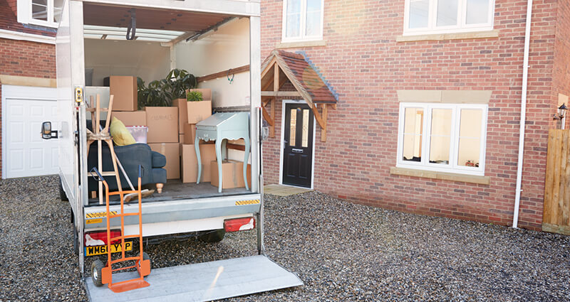 Moving van loaded and parked outside home