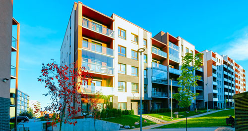 Kids unpacking boxes with their parents in modern living room