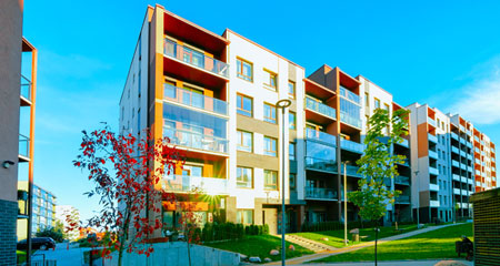 Kids unpacking boxes with their parents in modern living room