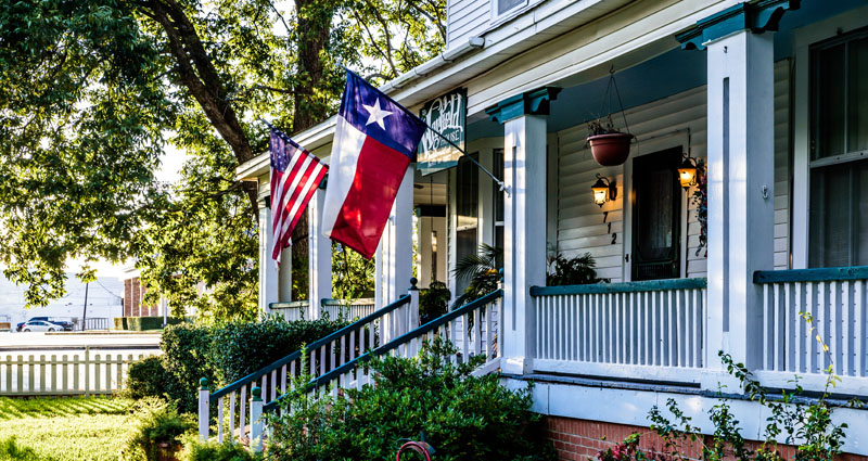 House porch with Texas flag.