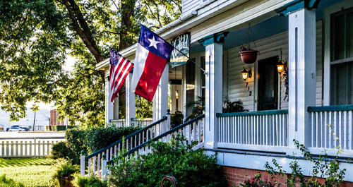 House porch with Texas flag.
