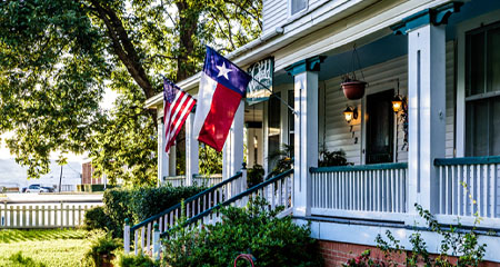 House porch with Texas flag.