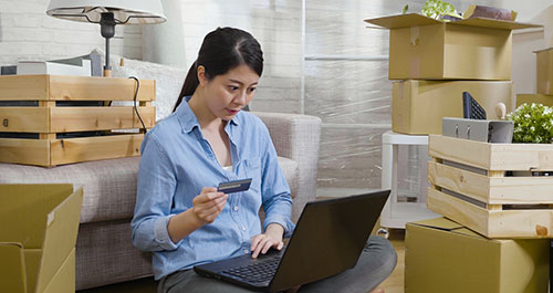 Woman shopping online with laptop