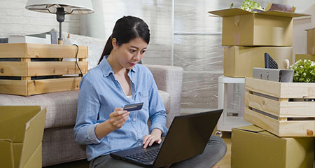 Woman shopping online with laptop