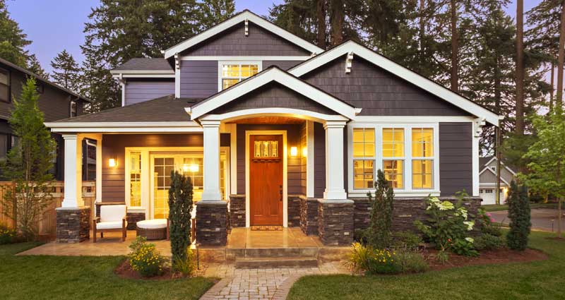 Front of house early evening with porch lights on