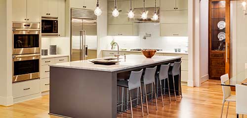 Beautiful kitchen with an island and hanging lights
