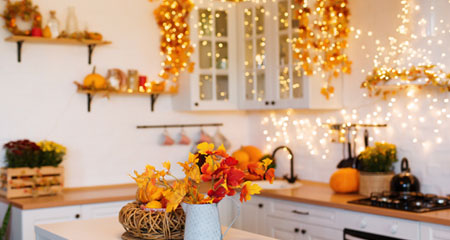 kitchen with fall decorations and lights