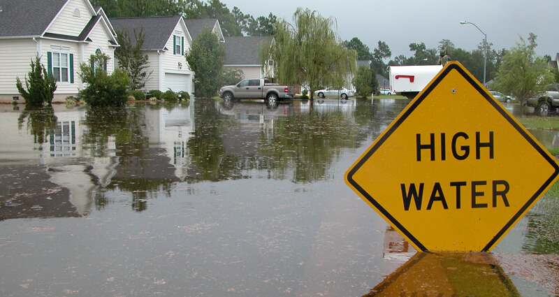 Pickup truck passing through flooded road