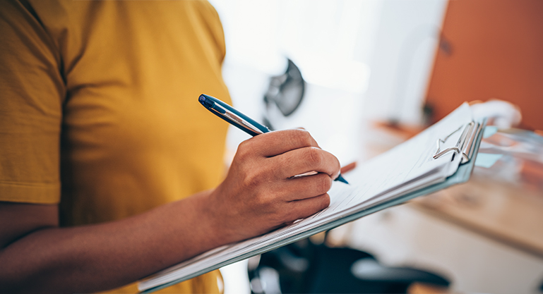 woman-signing-document