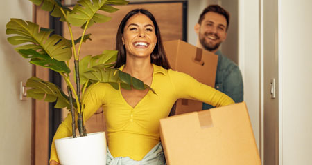 young couple moving into new home needing transfer energy