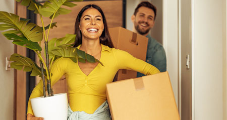 young couple moving into new home needing transfer energy
