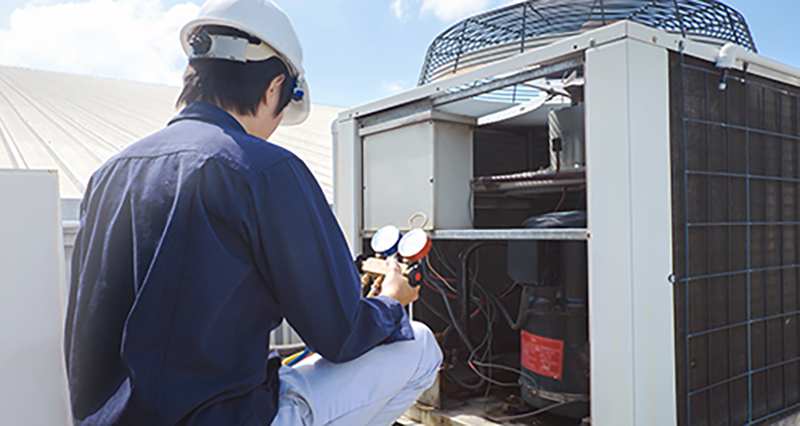 Photo of someone making repairs to their HVAC system