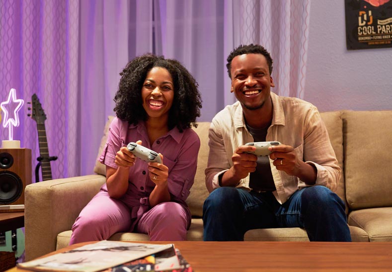 young woman and young man playing video games