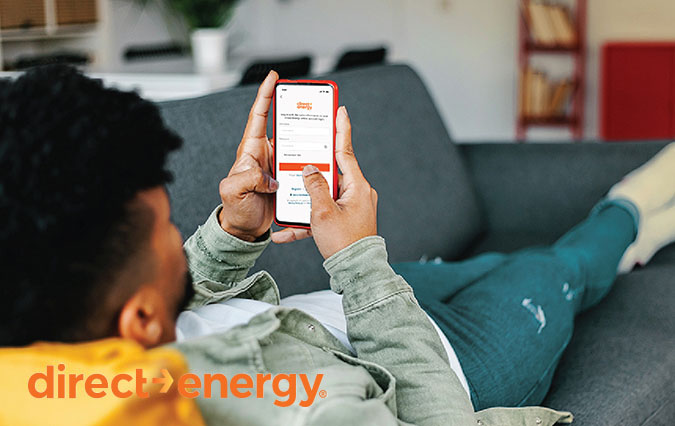 Man on couch using DE app Man on couch using DE app