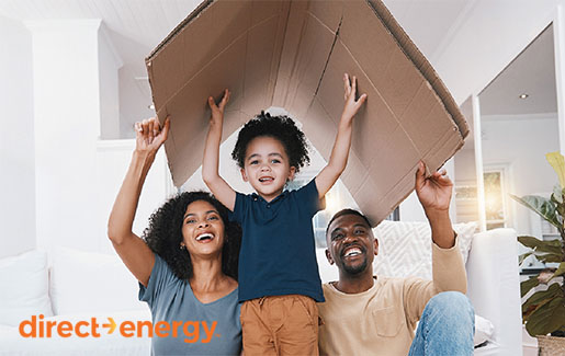 Family under cardboard box