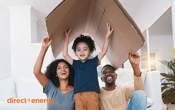 Family under cardboard box