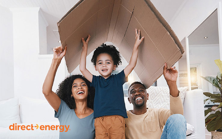 Family under cardboard box