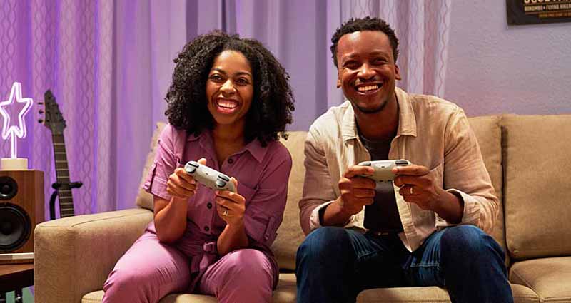young woman and young man playing video games
