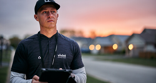 Vivint rep standing outside sunset